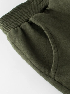 Olive green kids cotton jogger pants with elastic ribbed waistband and side pockets