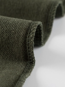 Army green children's cotton sweatpants showing high-quality knitted texture and overlock seams