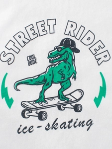 Maglietta bianca a maniche lunghe per bambini con stampa dinosauro su skateboard