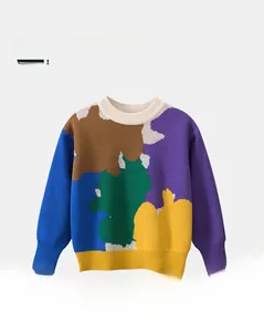 Detail of color block knitted cotton sweater featuring ribbed round neck and cuffs