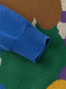 Kids colorful knit sweater with artistic pattern and blue ribbed cuffs for autumn