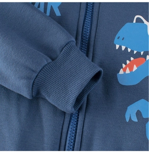 Detail of ribbed cuffs and zipper on kids navy dinosaur print fleece hoodie