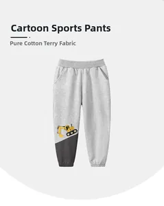 Detail of grey kids joggers in 100% Cotton French Terry with yellow excavator embroidery