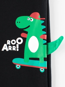 Zwarte sportbroek voor kinderen met groene dinosaurusprint en een 3D-staartje