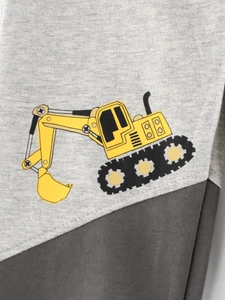 Kids grey knitted sports pants featuring a colorful cartoon excavator print for boys
