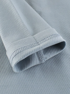 Close-up of baby boys long sleeve t-shirt sleeve cuff with premium sewing and ribbed texture