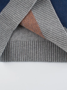 Kids navy blue knitted dinosaur sweater with grey ribbed cuffs and premium inner jacquard detail