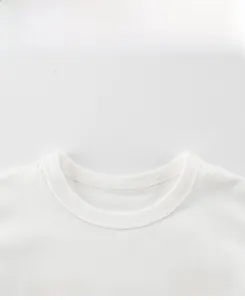 Detail view of cotton white T-shirt featuring a cartoon bear print and quality neckline stitching