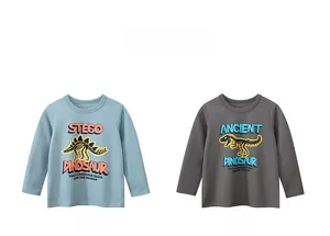 Detail of light blue and dark gray kids long sleeve t-shirts with dinosaur skeleton prints