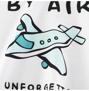 Close-up of white cotton fabric featuring a blue cartoon airplane print and BY AIR text