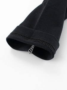 Kids long-sleeved t-shirt in black featuring high-quality ribbed knit cuffs and fine stitching