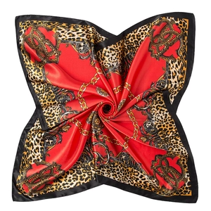 Detail of red satin square scarf with leopard print and golden baroque chain patterns