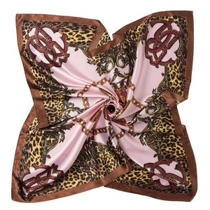 Pink silk scarf with leopard print and golden chain pattern on white background
