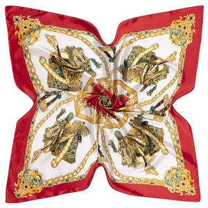 Detail of red and ivory satin silk scarf with gold equestrian saddle and scroll patterns