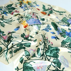 Satin floral square scarf with nature-inspired botanical prints on cream silk-like fabric