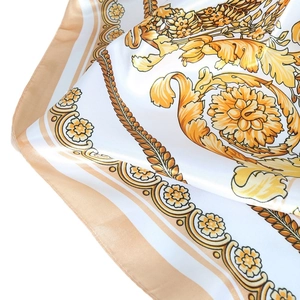 White satin silk square scarf featuring gold baroque floral patterns and chain motifs