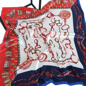Classic chain print satin silk scarf featuring horsebit and tassel motifs in red and navy