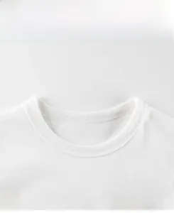 Close-up of crew neck stitching and ROAAAR print on boys long sleeve cotton T-shirt