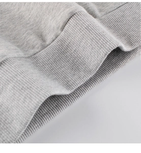 Close-up of the grey ribbed hem on this soft cotton blend toddler sweatshirt