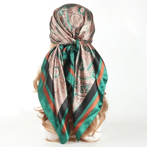 90cm satin square scarf with paisley print in dark green and gold on a model