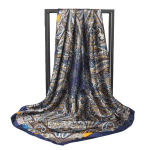 Vintage paisley print silk square scarf in navy blue and gold with elegant drape