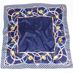 Detailed close-up of a 90cm satin square scarf featuring elegant chain and handbag patterns