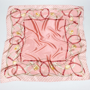Pink satin square scarf with fashion chain and belt print on a white background