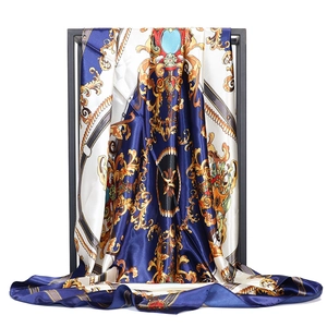 Detail of 90cm satin square scarf with baroque gold patterns and smooth silk texture