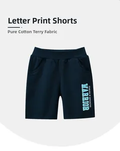 Détail du short en coton pour enfant montrant la taille élastique et l'imprimé WARRIOR