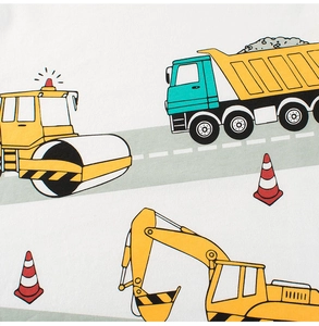 Detail of cotton kids t-shirt with colorful cartoon construction vehicle prints