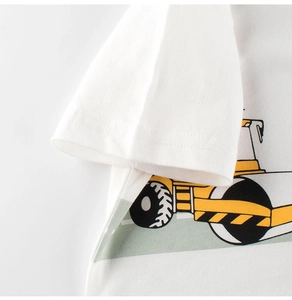Close-up of high-quality cotton kids' white T-shirt featuring a cartoon steamroller print