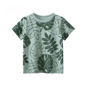 Detailed view of kids cotton t-shirt featuring green tropical palm leaf print patterns