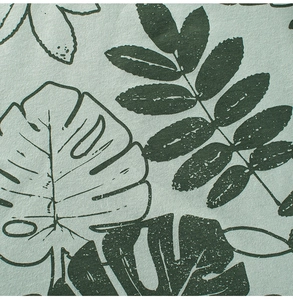 Close-up of tropical leaf print on soft cotton fabric for children t-shirts