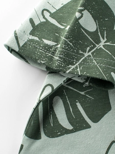 Kids cotton T-shirt with green palm leaf print showing premium stitching and fabric