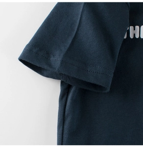 Detail of navy cotton T-shirt featuring high-quality double-needle stitching on the sleeve
