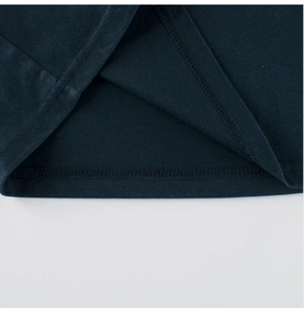 Detailed close-up of dark navy cotton T-shirt showing neat double-needle stitching hem