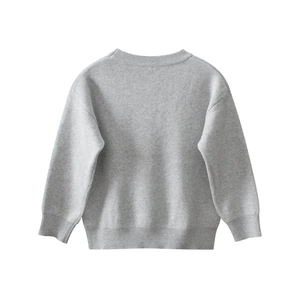 Detailed view of light gray knitted sweater featuring soft ribbed cuffs and neckline