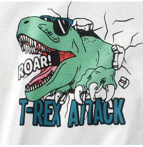 Close-up of cartoon green T-Rex printing with ROAR text on white cotton kids T-shirt