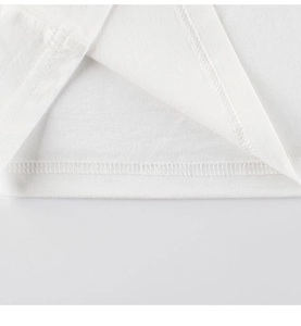 Detail of professional double-needle stitching on white cotton kids dinosaur t-shirt hem