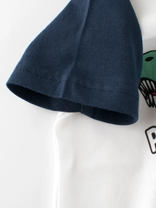 Boys dinosaur raglan T-shirt in white and navy cotton fabric with fine stitching