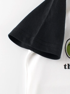 Short sleeve raglan T-shirt for boys in black and white cotton with green circular print