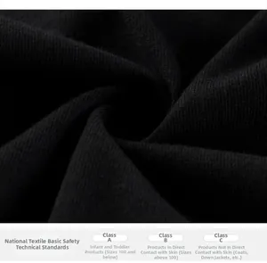 Macro detail of breathable black cotton fabric with textile safety standards for kids
