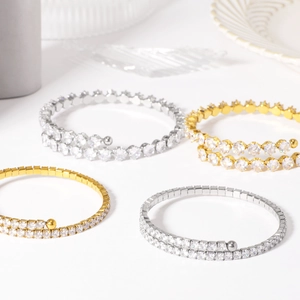 Set of four luxury gold and silver wrap bracelets with sparkling zircon and bead accents