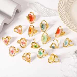 Preserved dried flower resin rings in oval and heart shapes with gold metal base