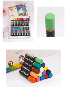 Macro shot of colorful oil pastel set with 24 vibrant colors and owl illustration box