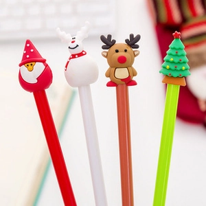 Close-up of set of four Christmas themed pens with cute 3D cartoon characters on top
