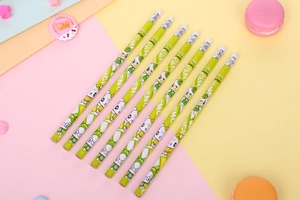Detail of HB pencils featuring green cartoon bear patterns and white eraser tops