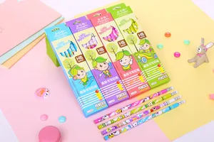 Close-up of HB cartoon pencils with erasers in colorful boxes on creative desk layout