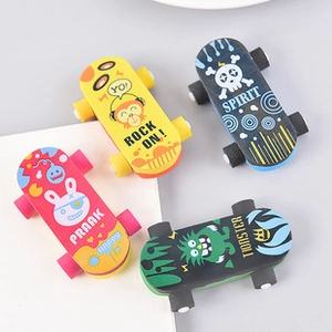 Detail of four colorful skateboard-shaped erasers featuring fun cartoon graphic patterns