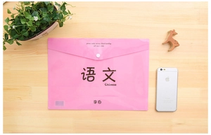 Pink A4 Chinese subject document folder with snap button on a wooden desk setup